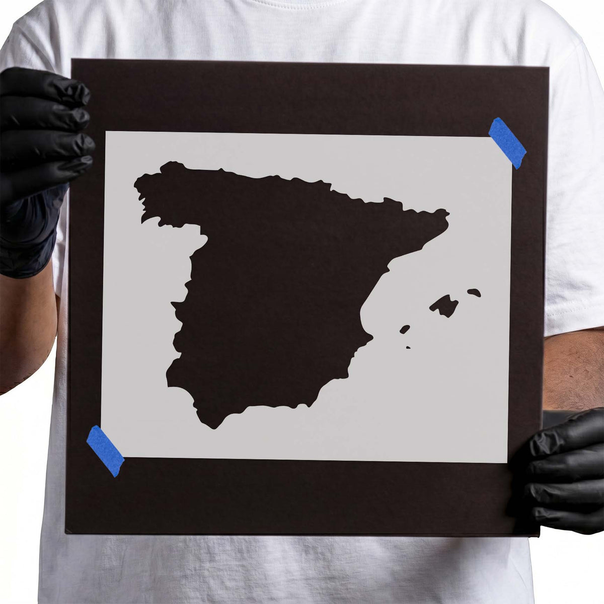 Spain stencil showing the country's solid geographical outline with nearby island silhouettes