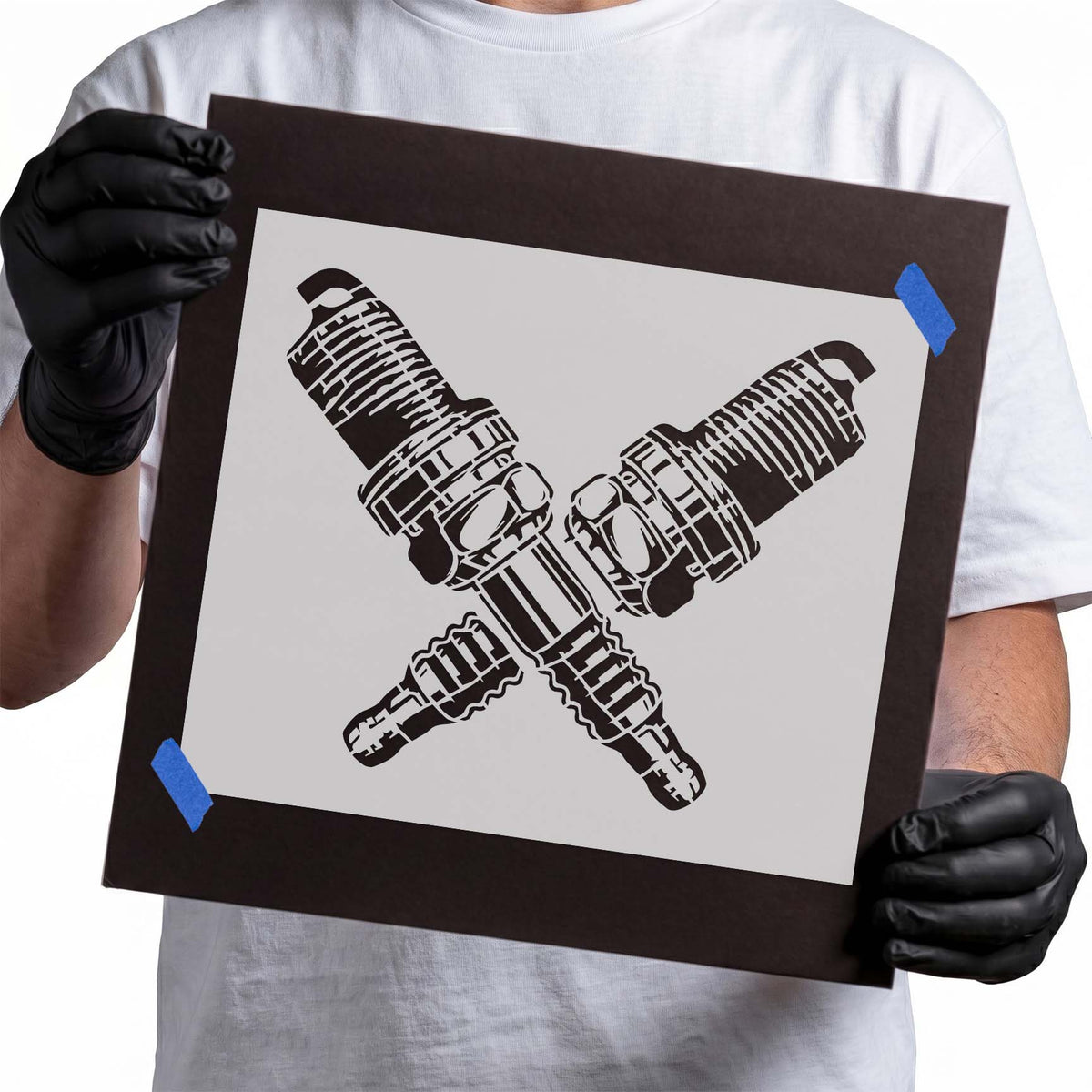 Spark Plugs stencil featuring two crossed engine spark plugs with detailed threads and electrodes