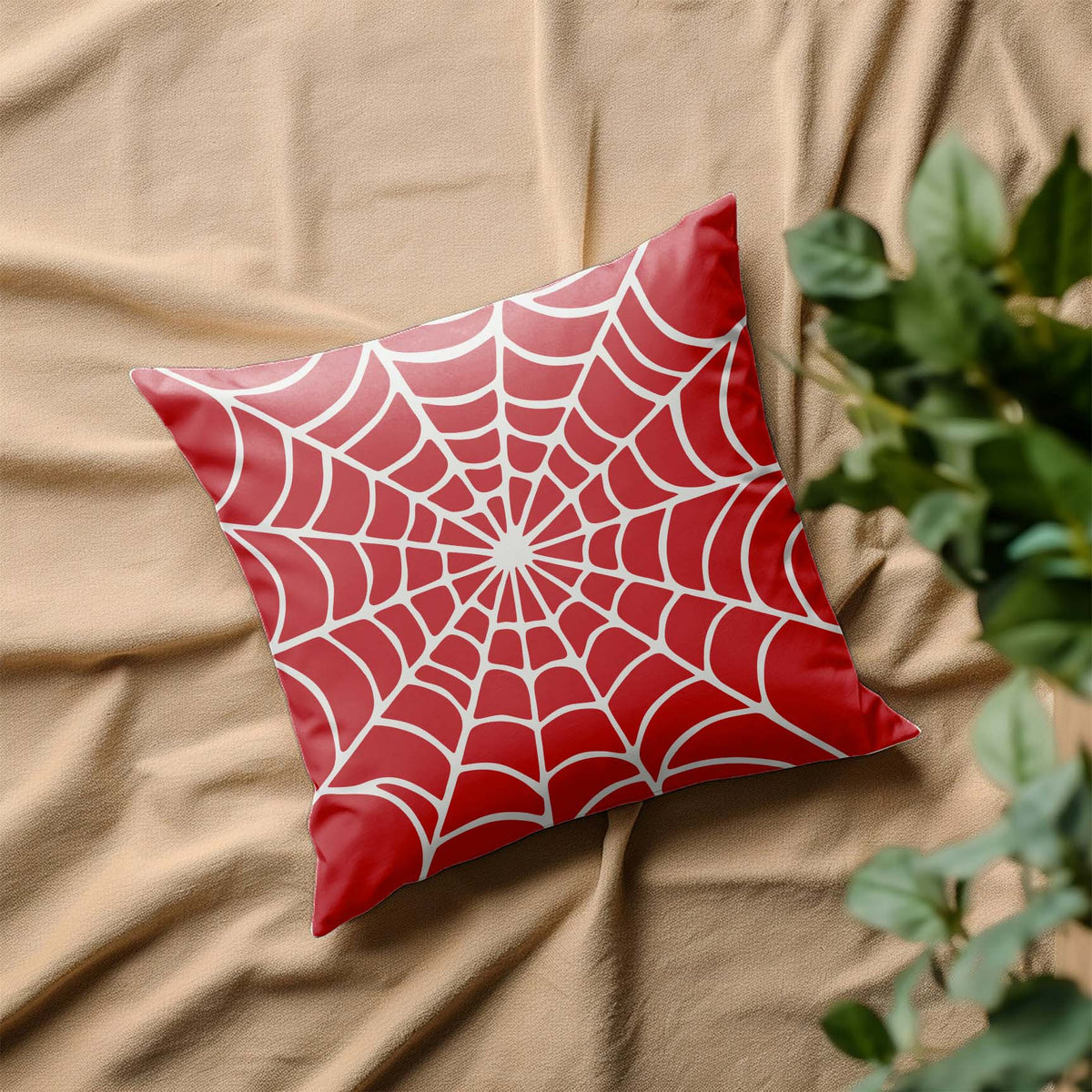 Spider Web Radial Pattern Stencil covers a red accent pillow with crisp white web lines