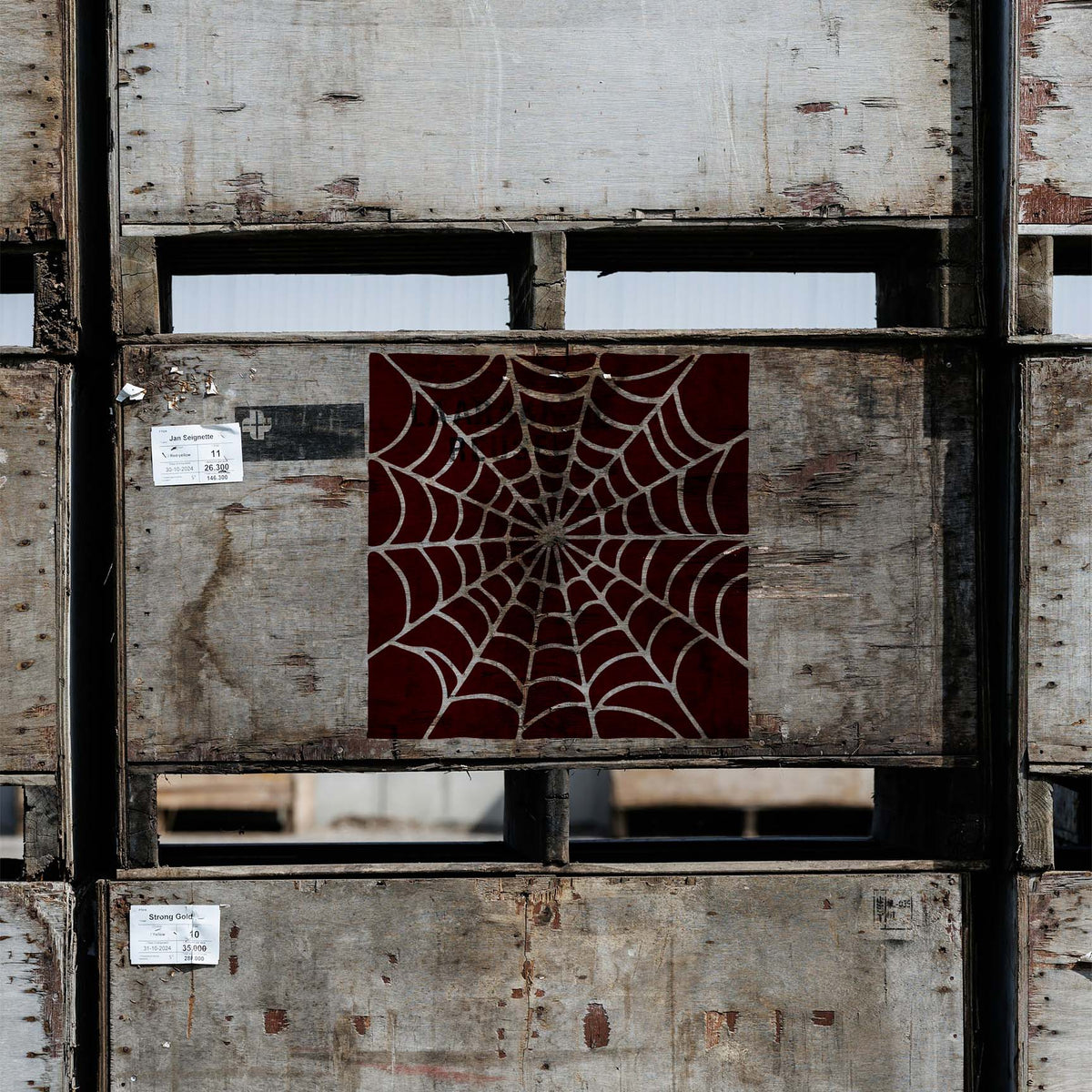 Rustic crates feature the Spider Web Radial Pattern Stencil in a deep red centered design