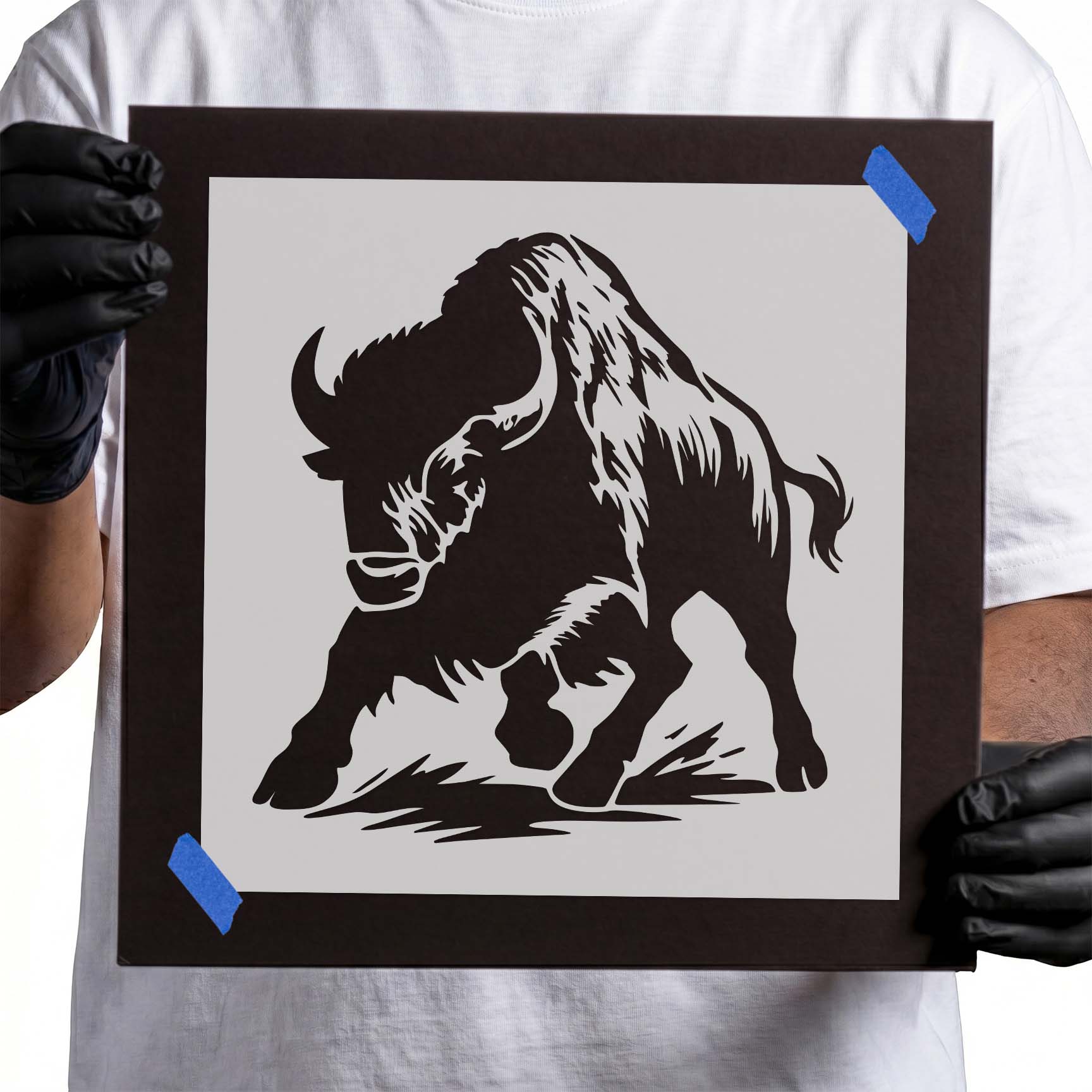 Bison stencil with lowered head, curved horns, and shaggy coat
