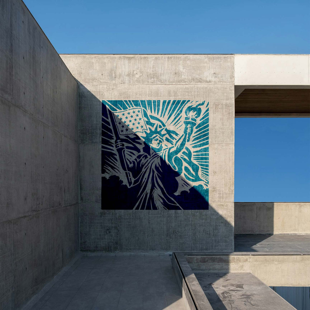 Statue of Liberty American Flag Stencil mural in blue tones on a modern concrete wall