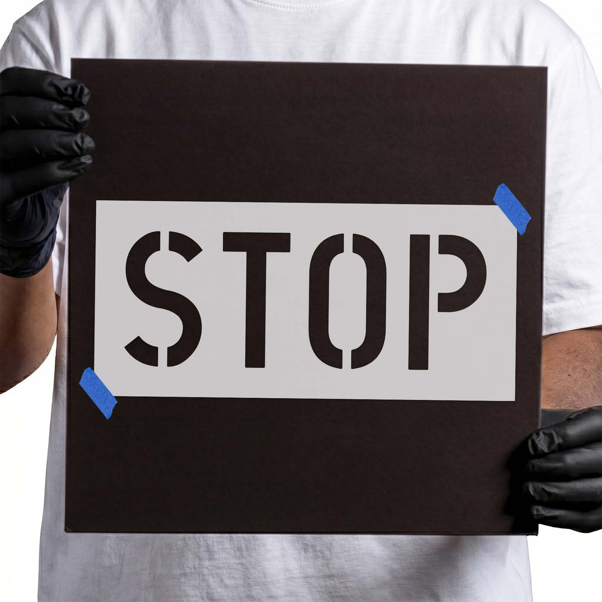 Stop stencil featuring large uppercase block letters with distinctive cutout breaks