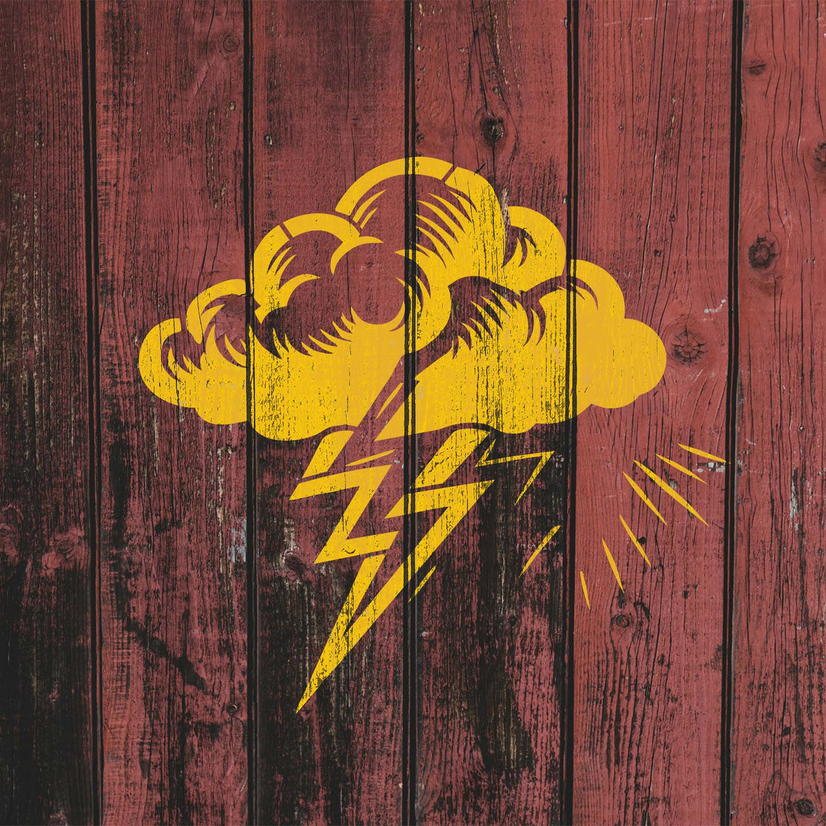 Storm Cloud Lightning Bolt Stencil painted yellow across weathered red wood planks