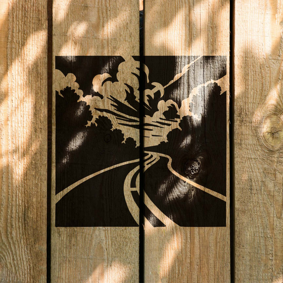 Sunlit Forest Highway View Stencil painted across natural wood fence boards