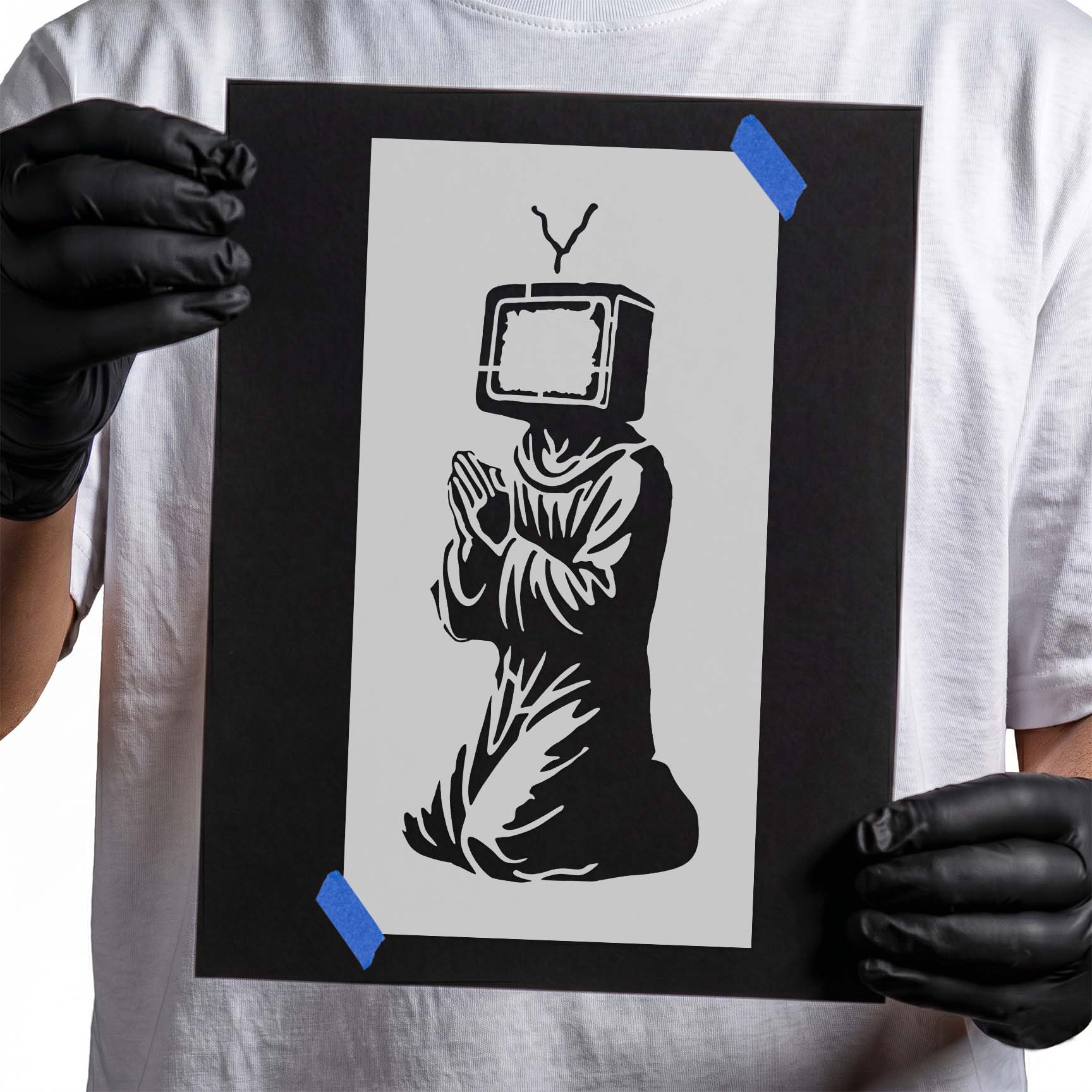 Surreal television-headed monk kneeling with hands pressed together in prayer