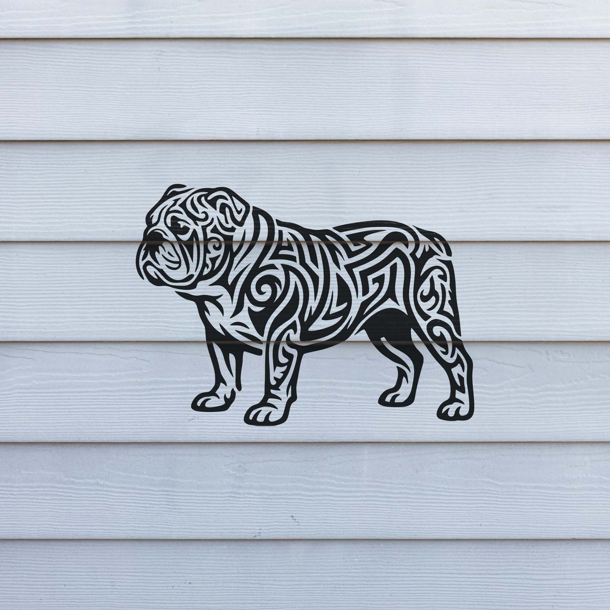 Across white horizontal siding, the Tribal Bulldog Stencil reveals a powerful dog in ornate black lines.