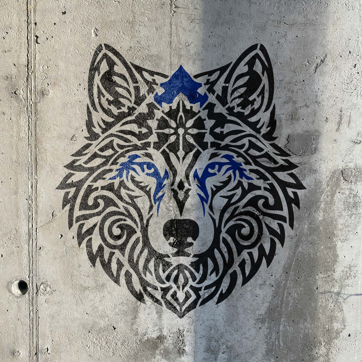 Tribal Mandala Wolf Head Stencil painted on textured concrete wall