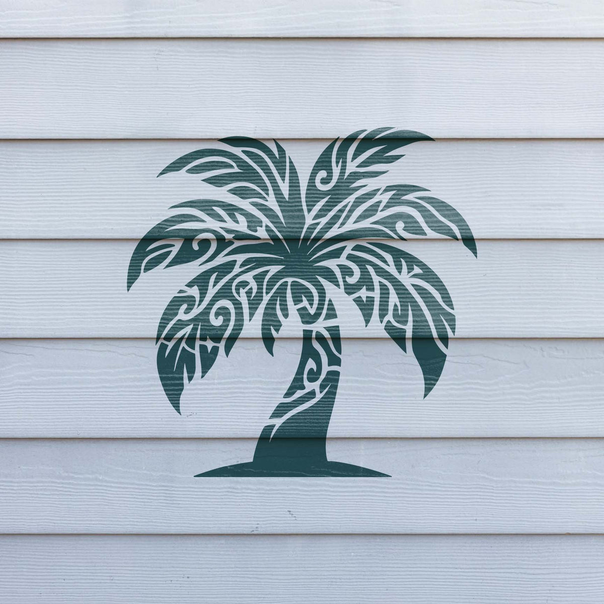 Deep green Tribal Palm Tree Stencil displays ornate curling leaves across white exterior siding