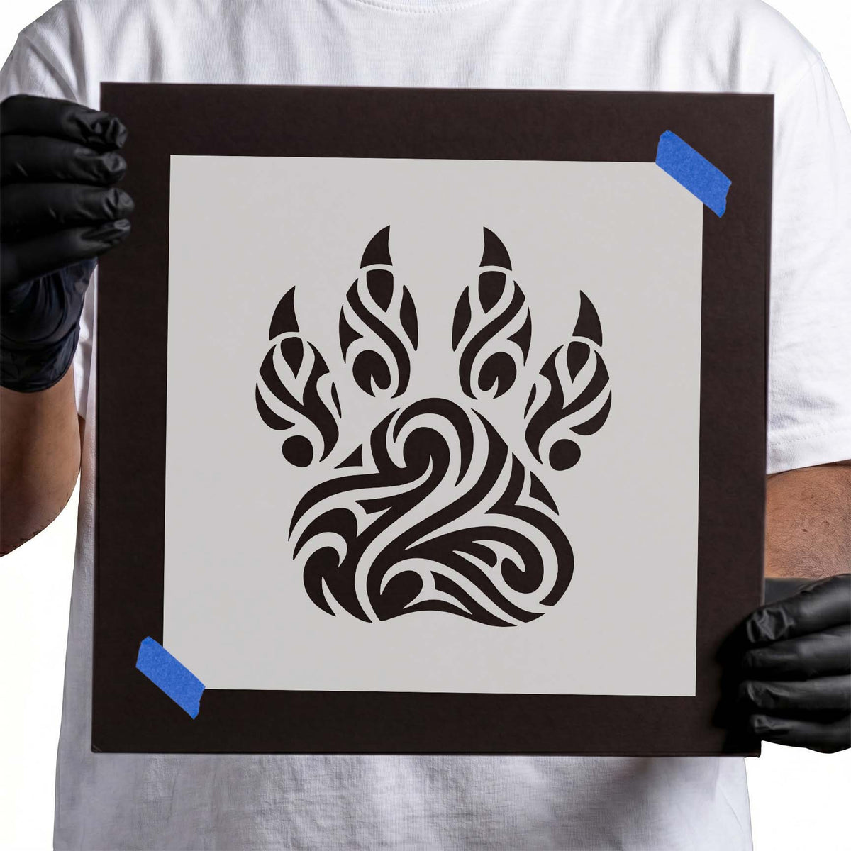 Paw print stencil filled with flowing curves and intricate tribal patterns