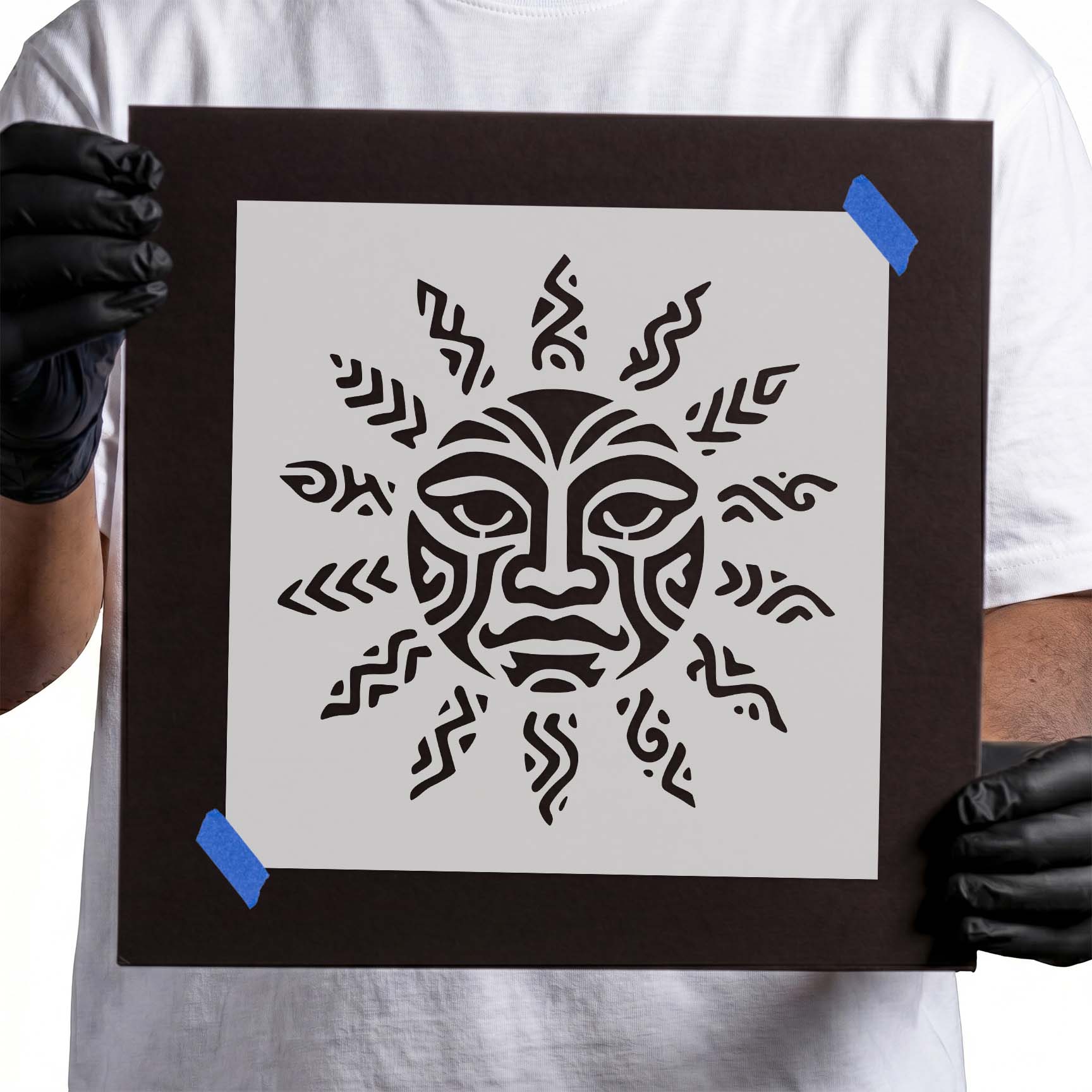Stylized tribal sun face with bold geometric rays and decorative features.
