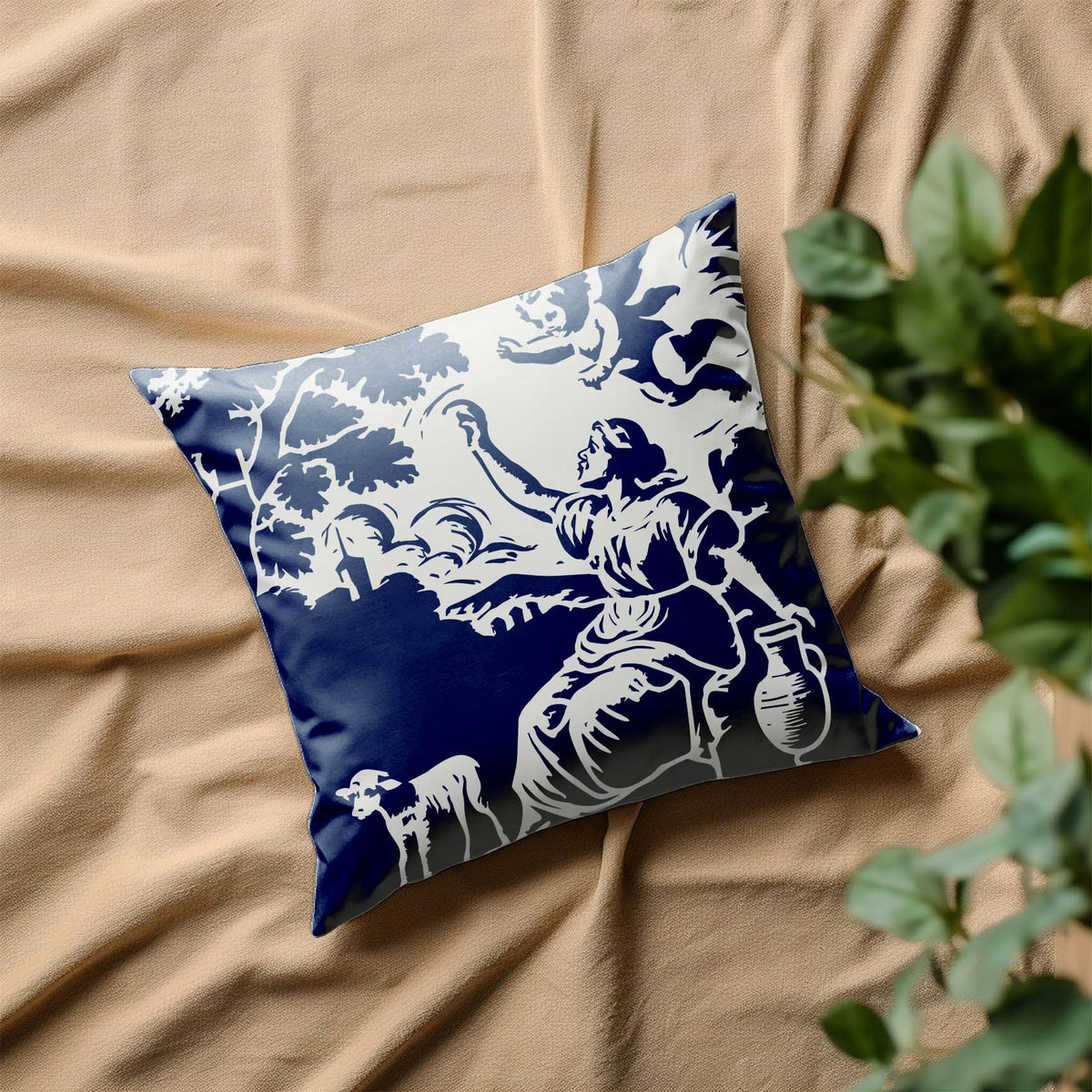 A navy Vintage Cherub & Shepherdess Toile Stencil brings pastoral charm to a decorative pillow.
