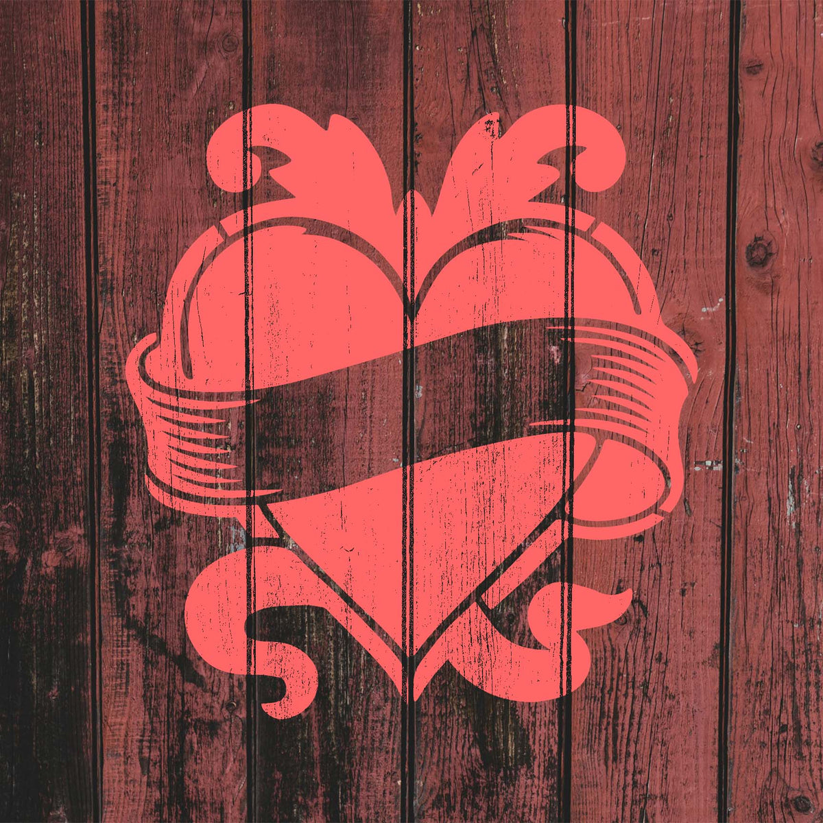 A rustic wood backdrop showcases the Vintage Heart Banner Stencil in a weathered red finish