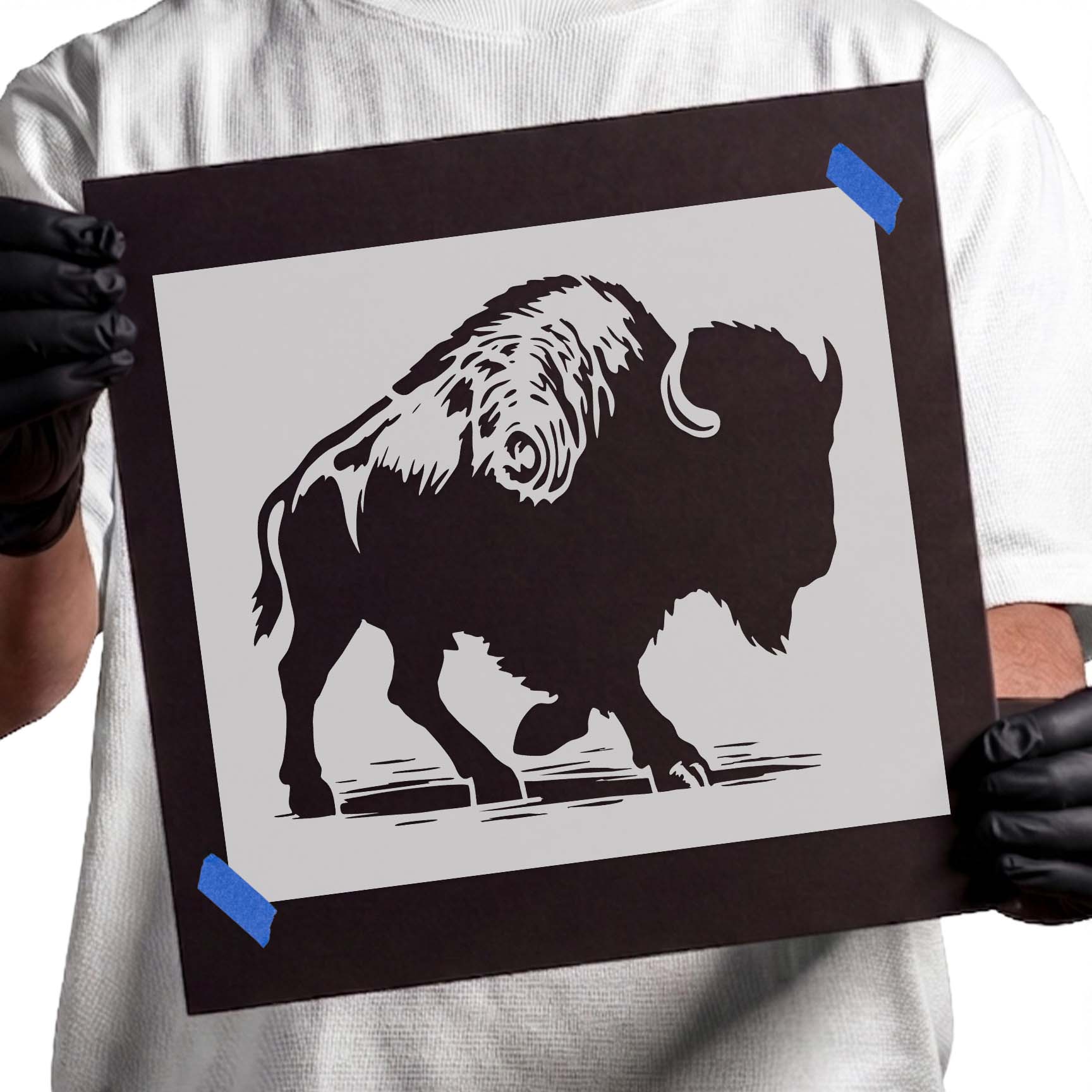 Walking bison stencil with curved horns and shaggy coat details
