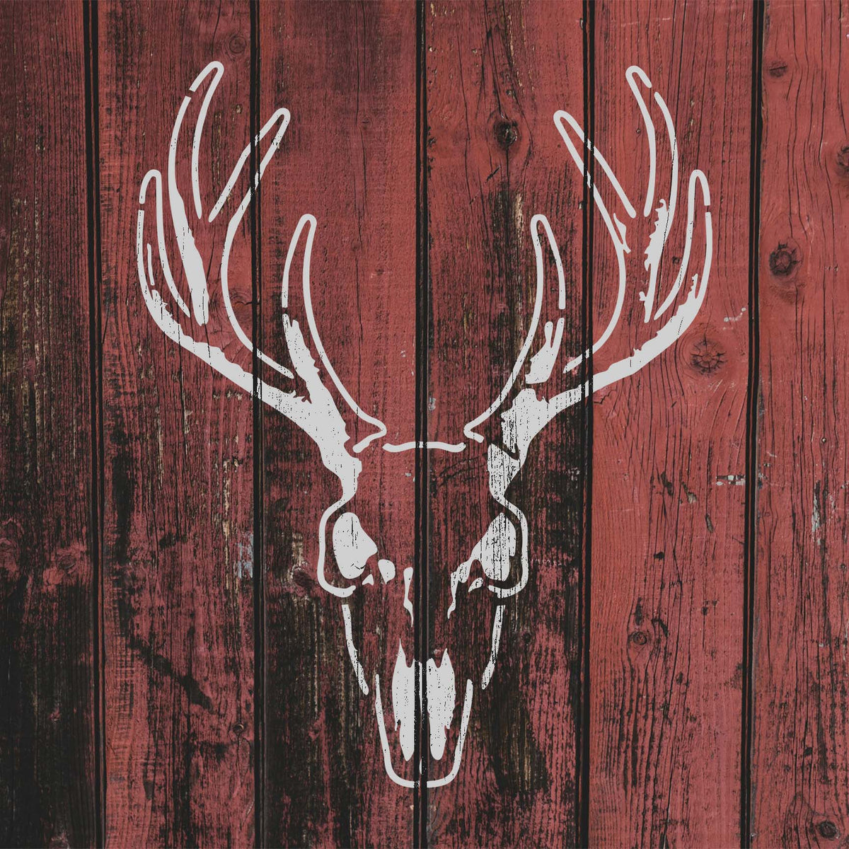 Rustic wood boards feature the Whitetail Buck Skull Stencil with broad branching antlers