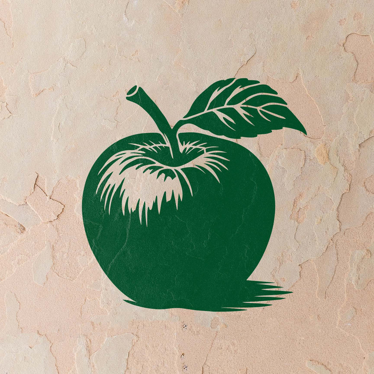 Painted on a textured beige wall, the Whole Apple with Stem and Leaf Stencil shows crisp green details.