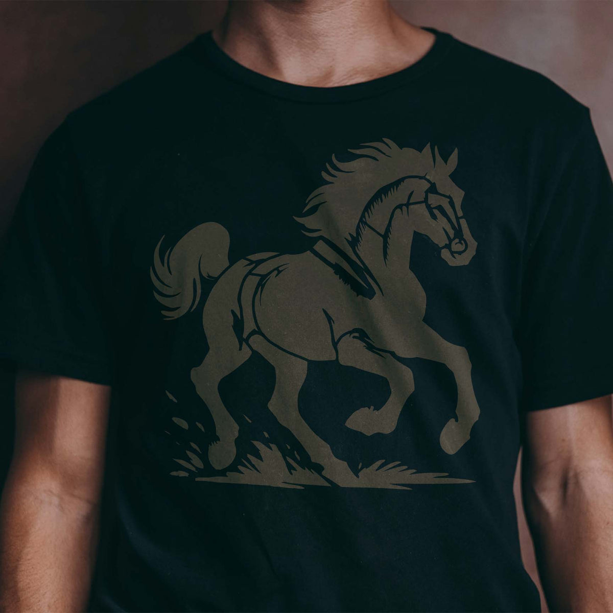 Gray Wild Mustang Stencil design featured on a black T-shirt