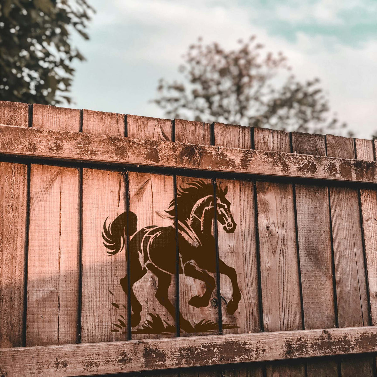 Rustic fence display of the Wild Mustang Stencil in a running horse silhouette