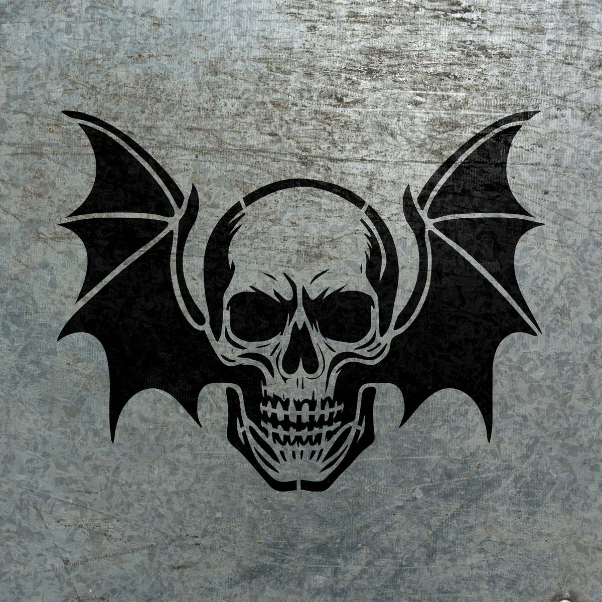 Dark Winged Skull Gothic Stencil stands out sharply against a weathered metal surface
