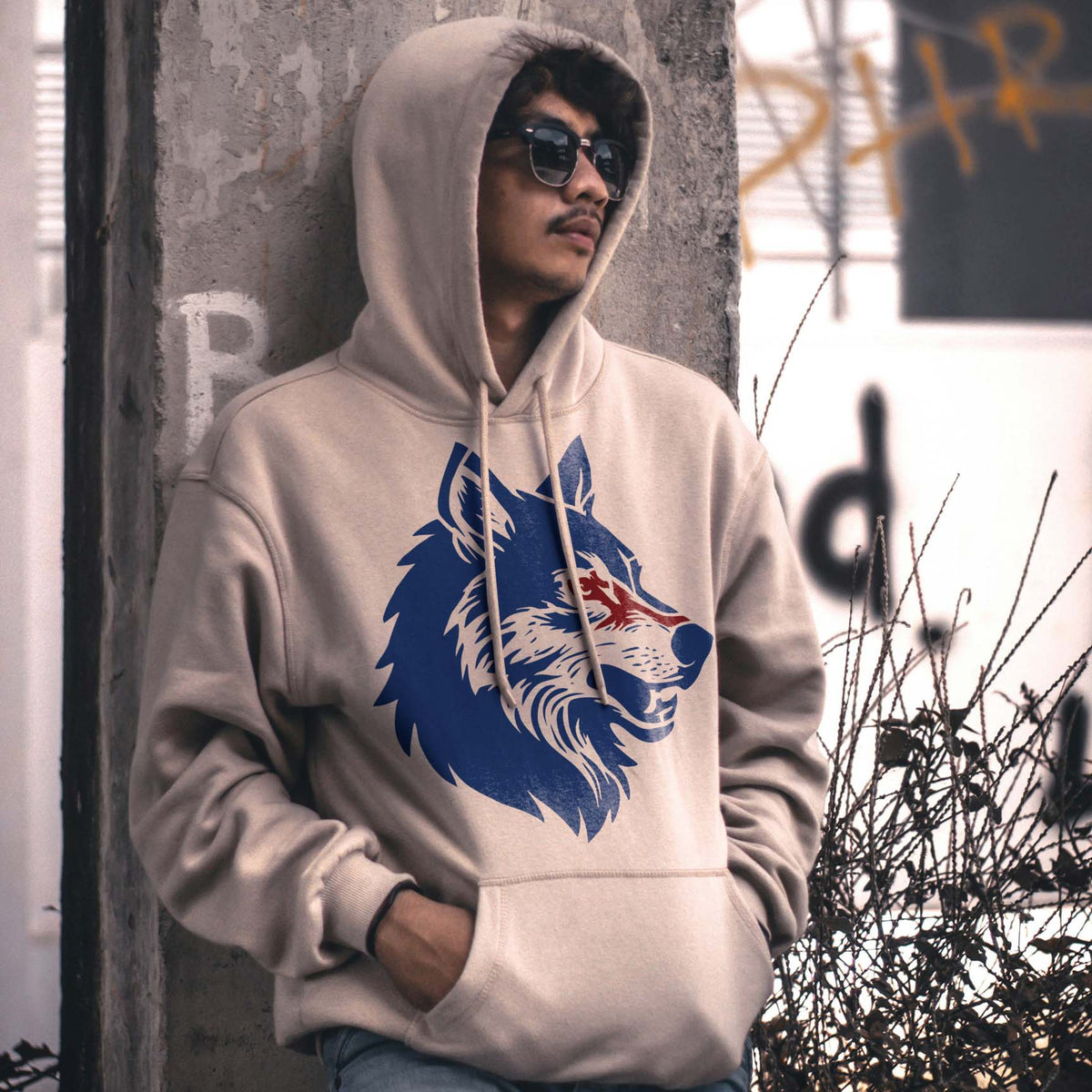 Wolf Head Profile Stencil printed in blue and red on a beige hoodie