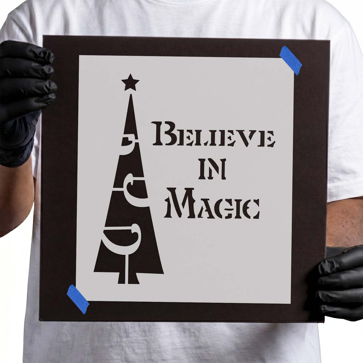 Christmas tree stencil with star and Believe in Magic lettering