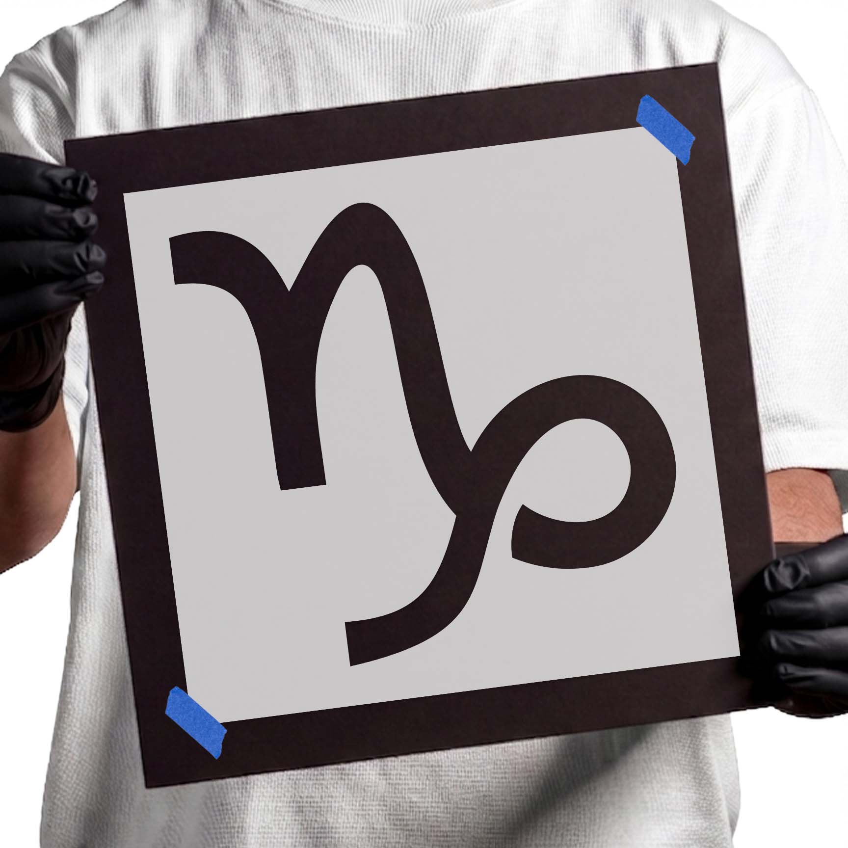 Capricorn zodiac symbol stencil with bold curved glyph and looping tail