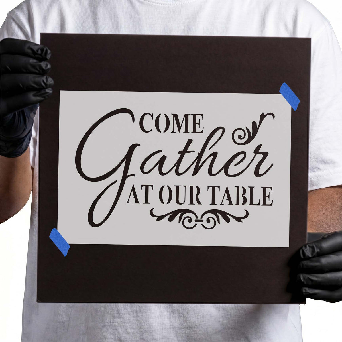Gather at our table stencil with flowing script and ornamental flourishes