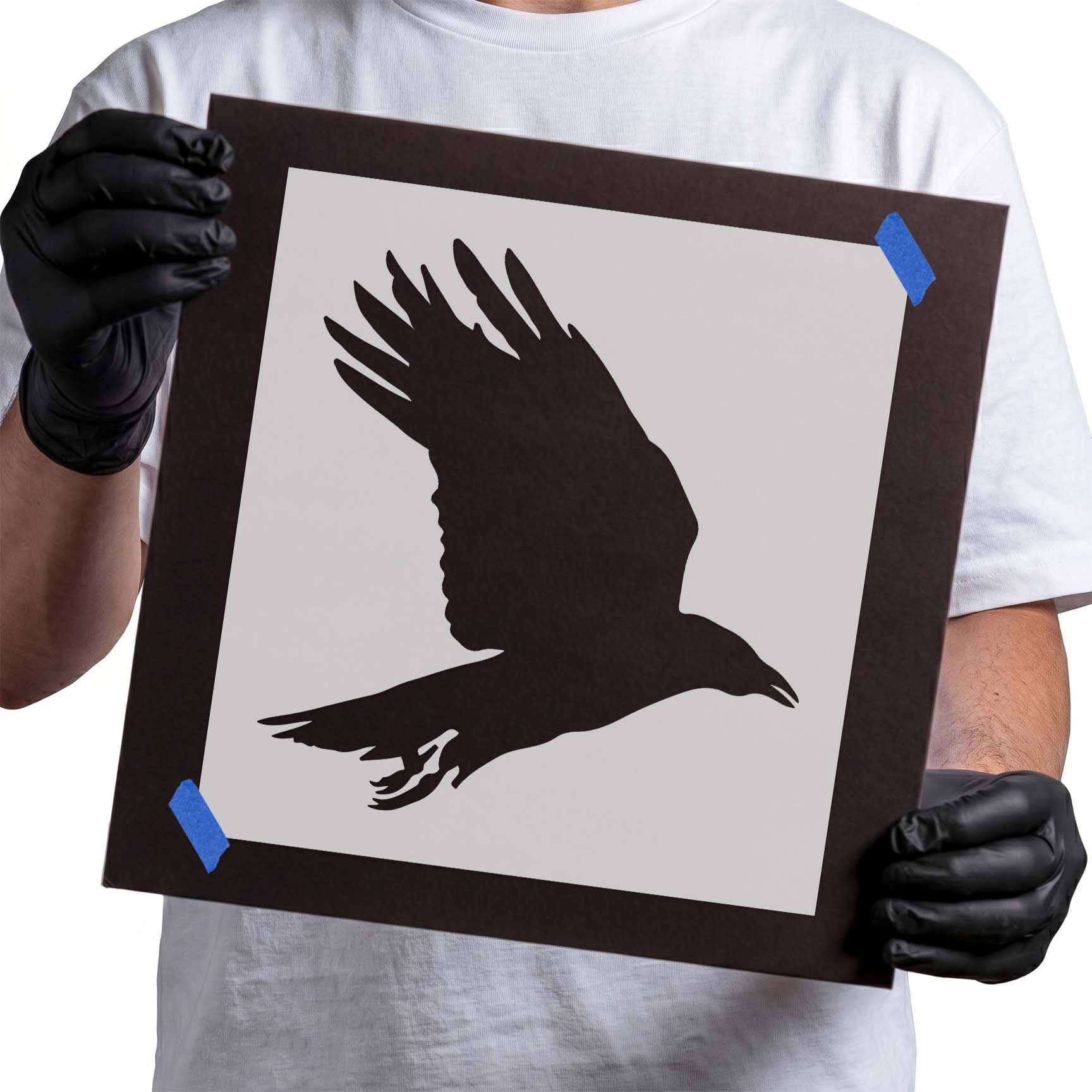 Crow stencil with outstretched wings and extended talons