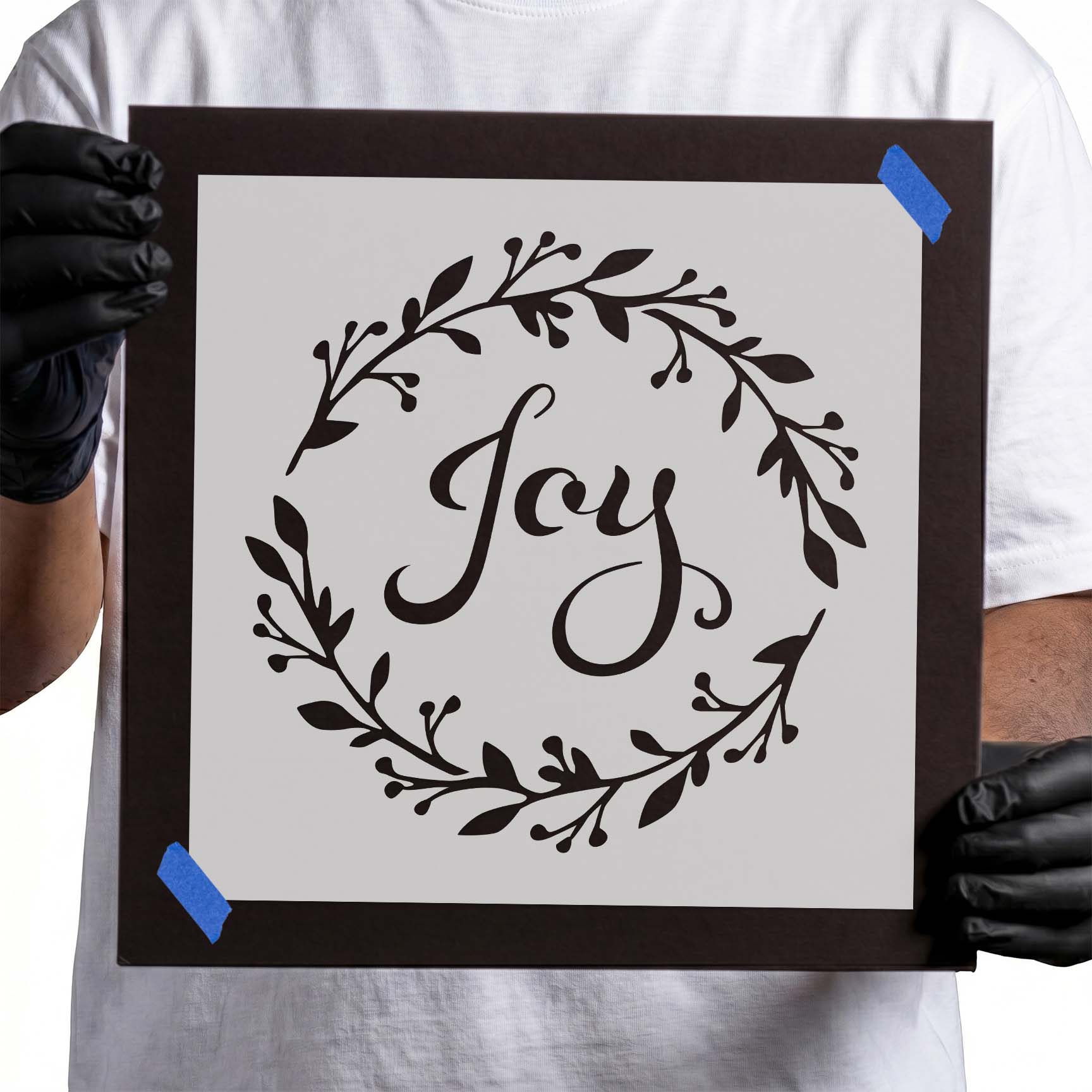 Joy wreath stencil with script lettering and leafy botanical branches