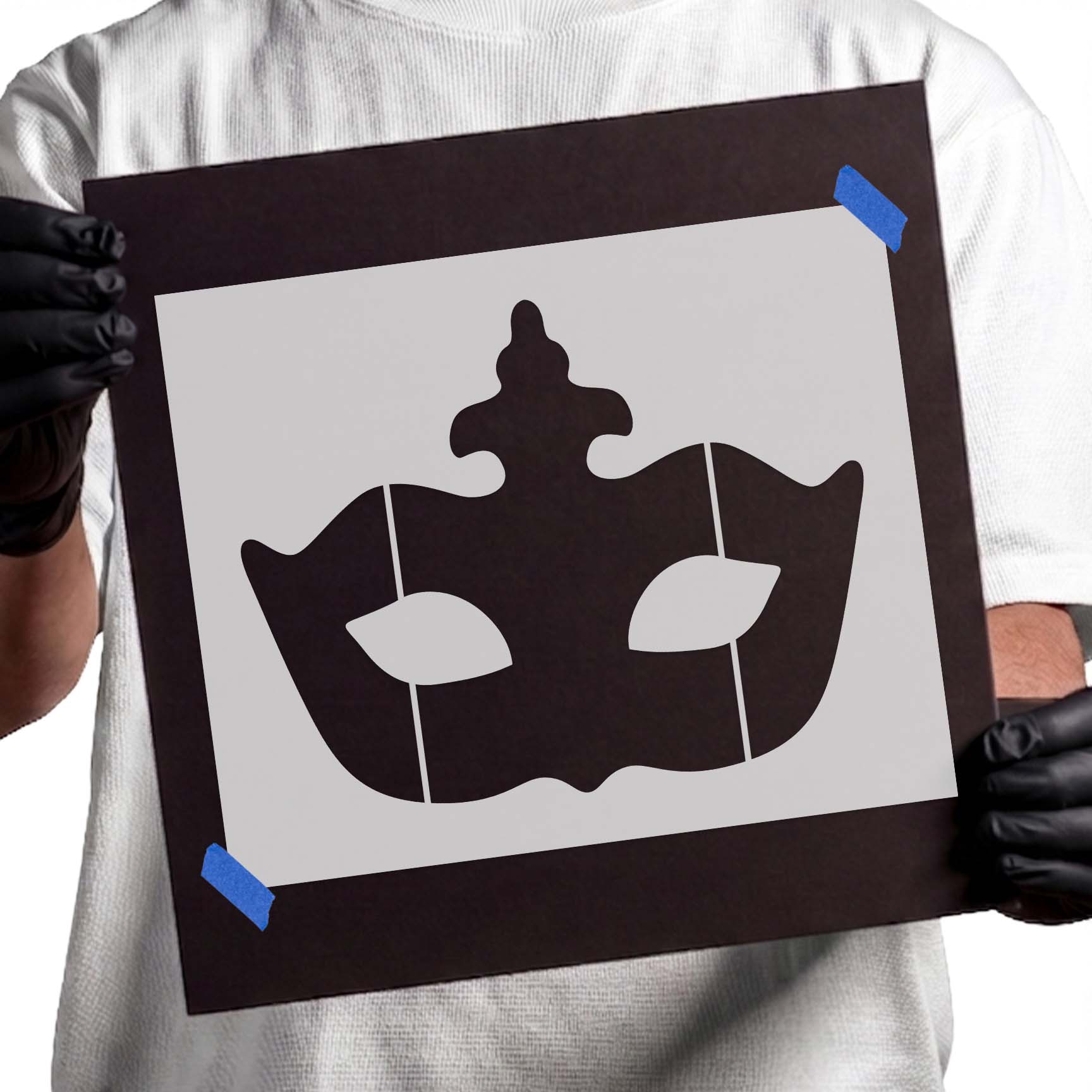 Masquerade mask stencil with curved silhouette and stylized eye openings