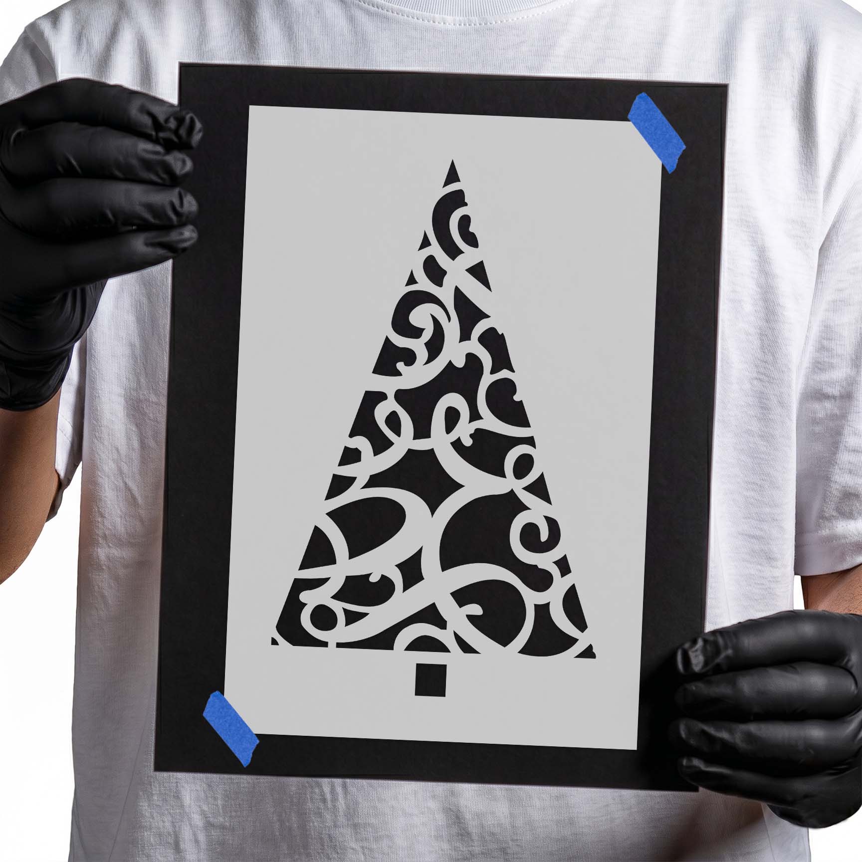 Ornate Christmas tree stencil with decorative curls and swirling flourishes
