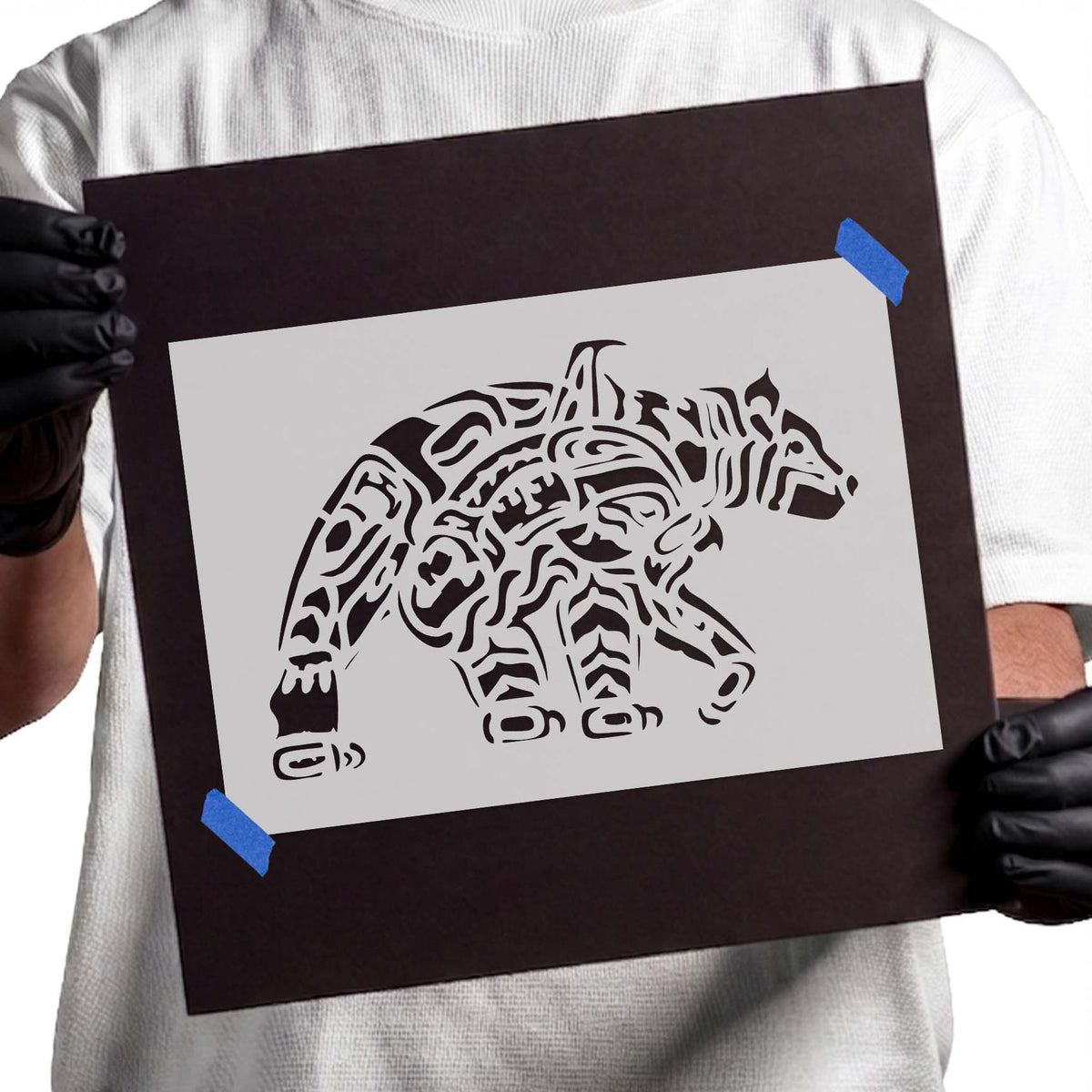 Stylized bear stencil with intricate flowing decorative linework