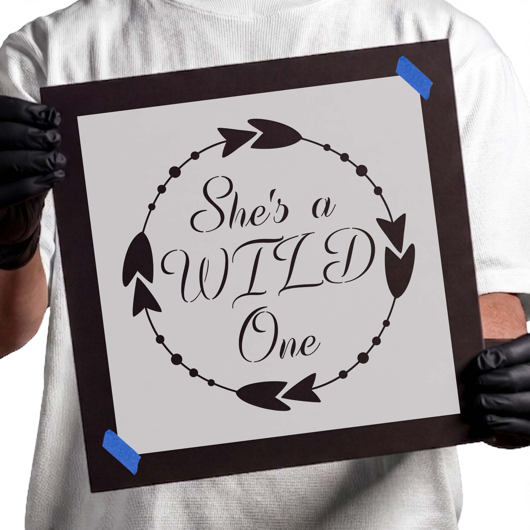 She's a Wild One lettering surrounded by decorative arrows and dots