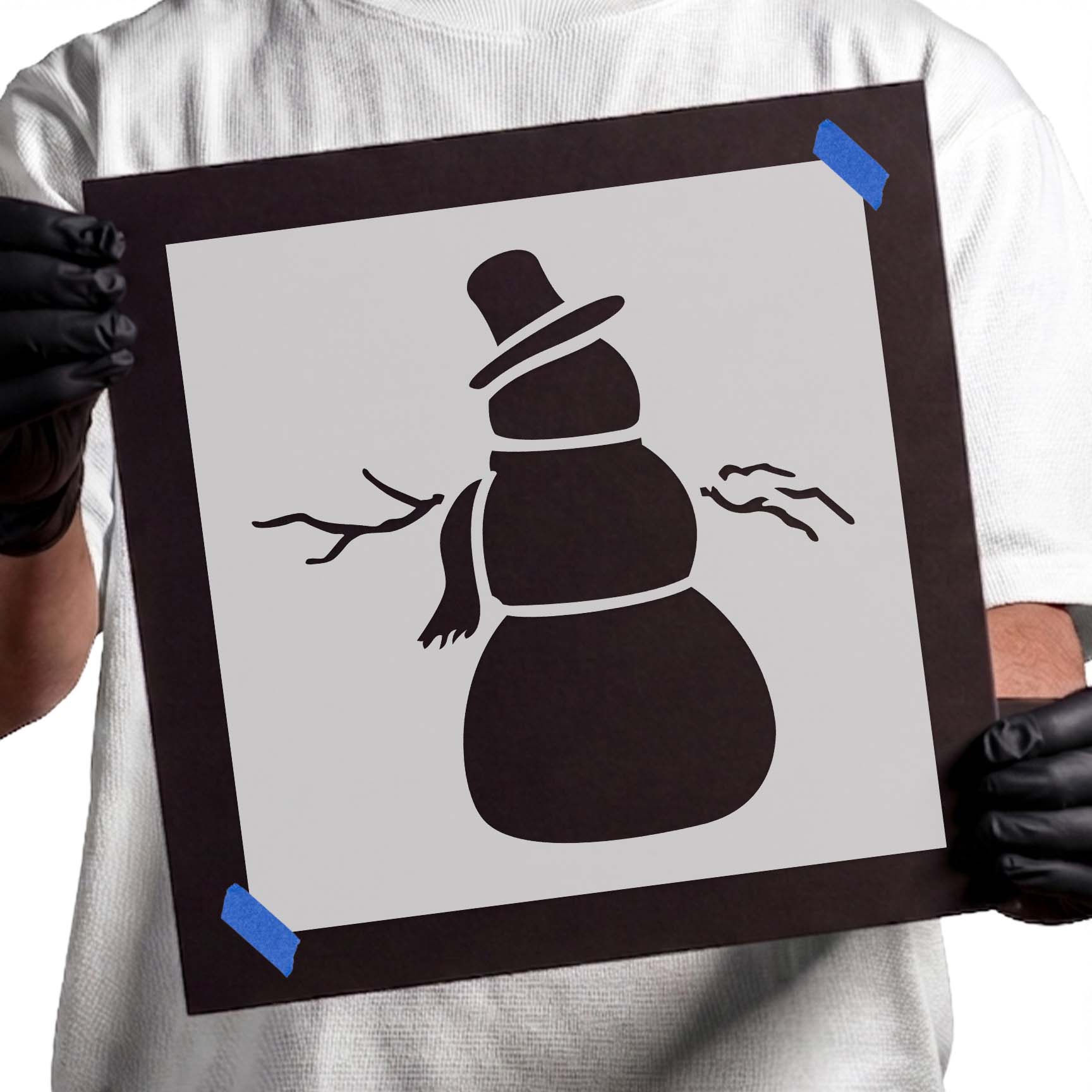 Snowman stencil with top hat, scarf, and outstretched branch arms