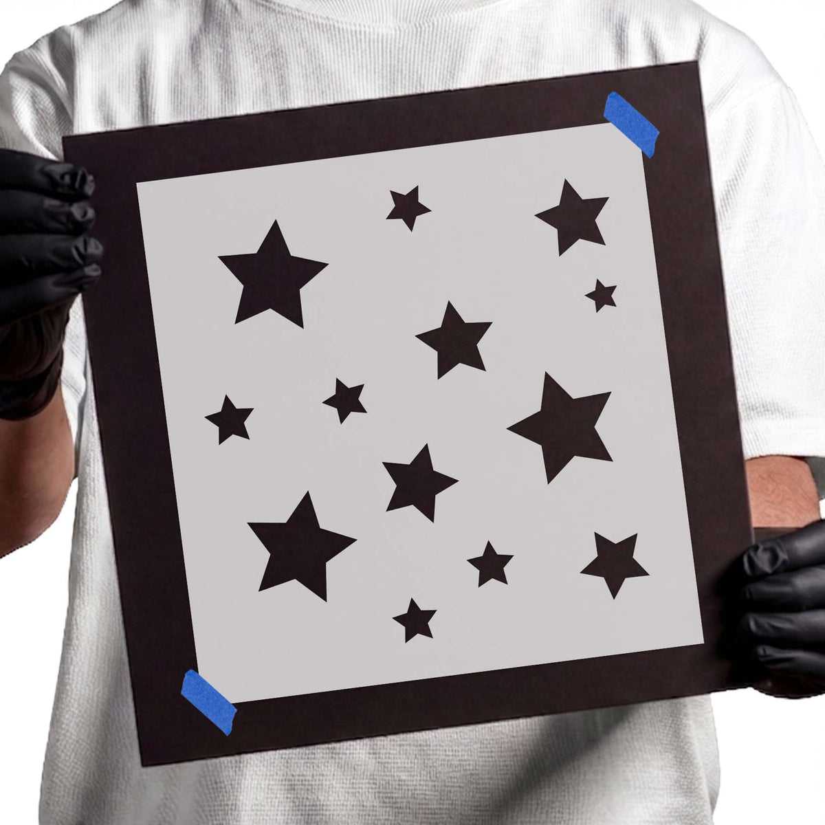 Stencil with scattered five-point stars in assorted sizes