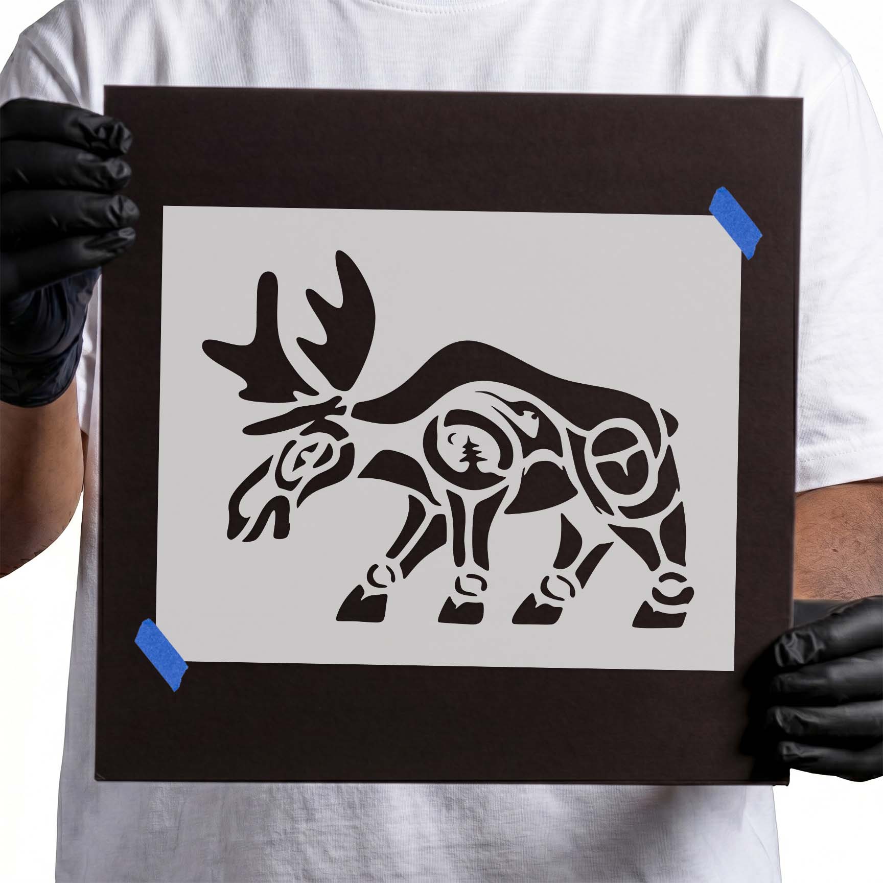 Stylized moose stencil with antlers and evergreen tree detail