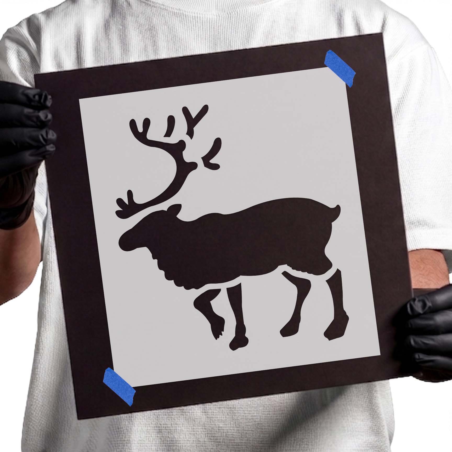 Walking reindeer stencil with large branching antlers and defined legs