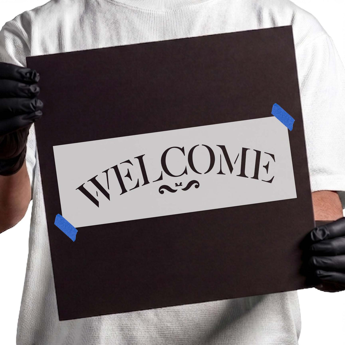 Welcome stencil with arched serif lettering and ornamental flourish
