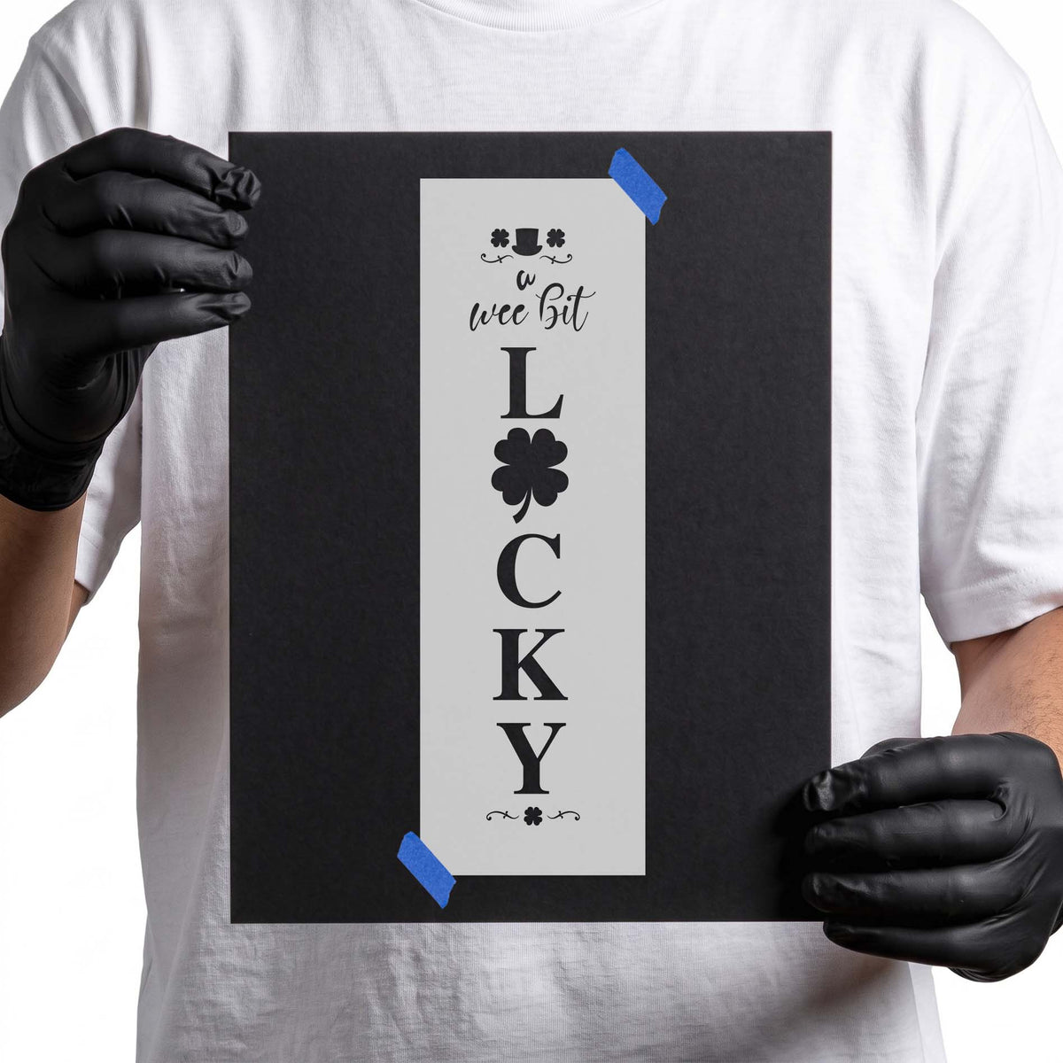 Irish stencil with vertical lucky lettering, shamrock, clovers, and top hat