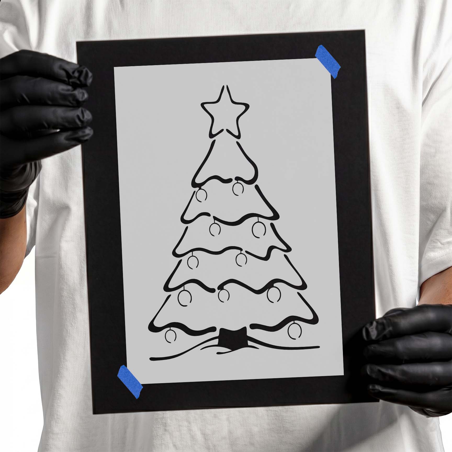 Christmas tree stencil with ornaments, layered branches, and star topper