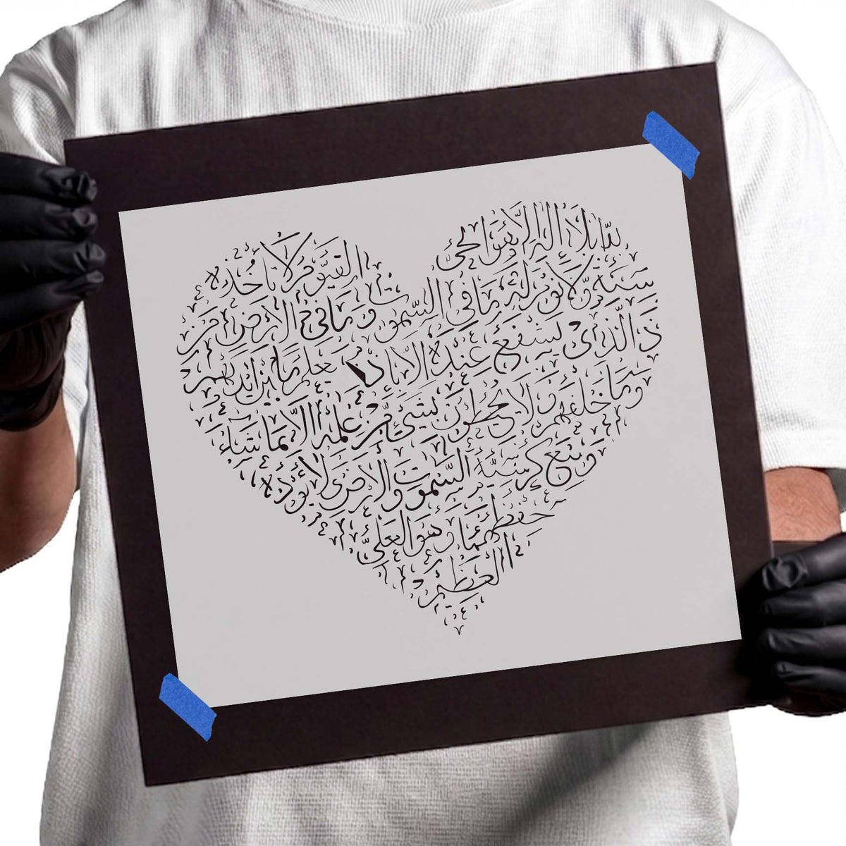 Heart stencil filled with intricate flowing Arabic-style calligraphy