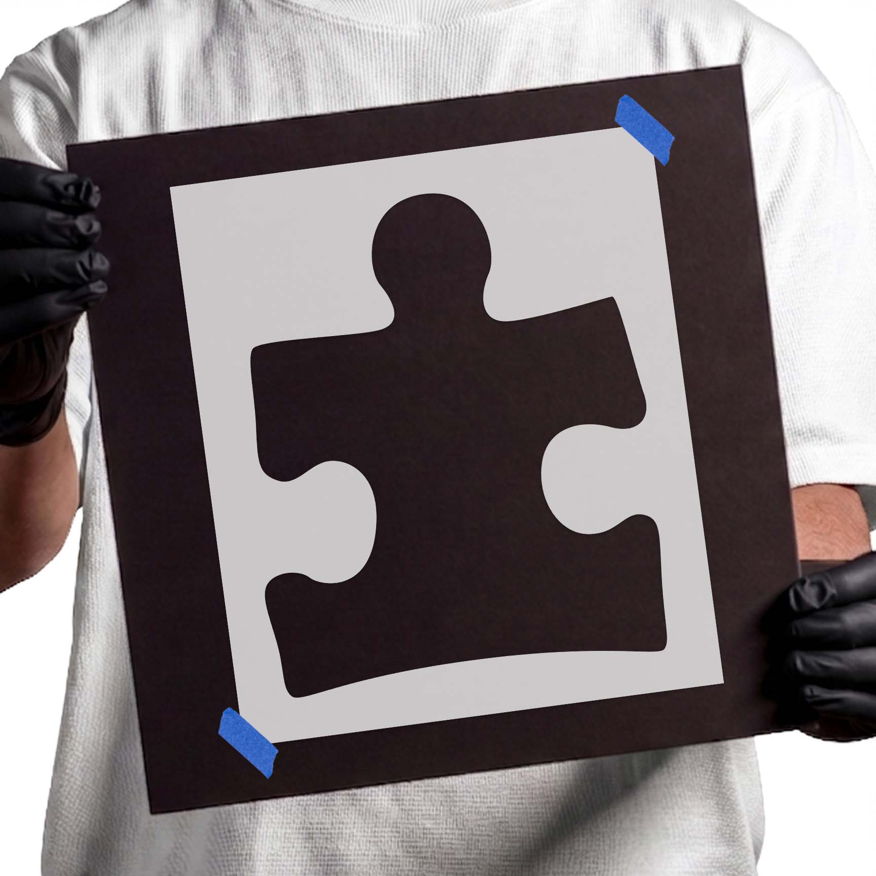 Puzzle piece stencil with rounded tabs and curved openings