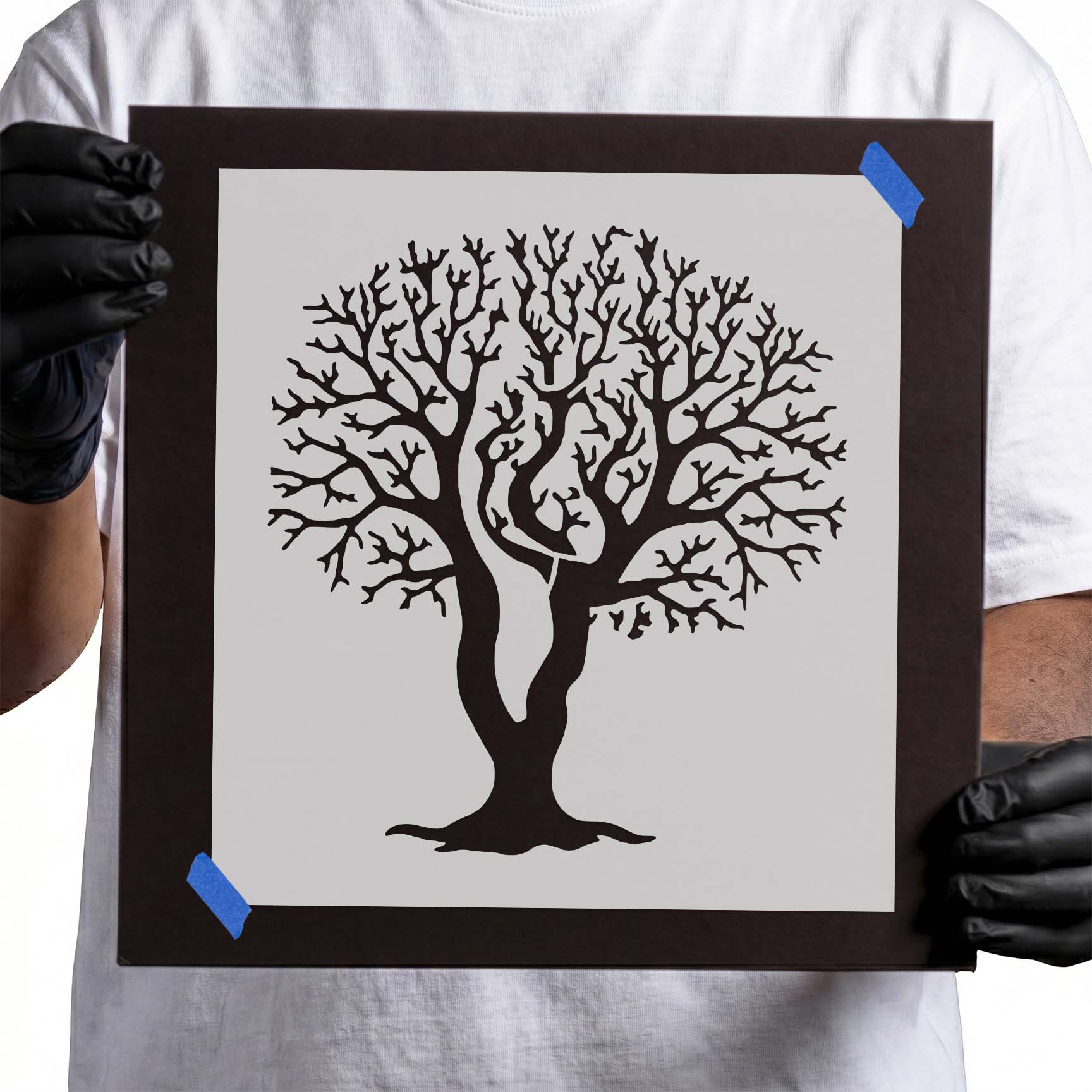 Leafless tree stencil with curved trunk and intricate twisting branches