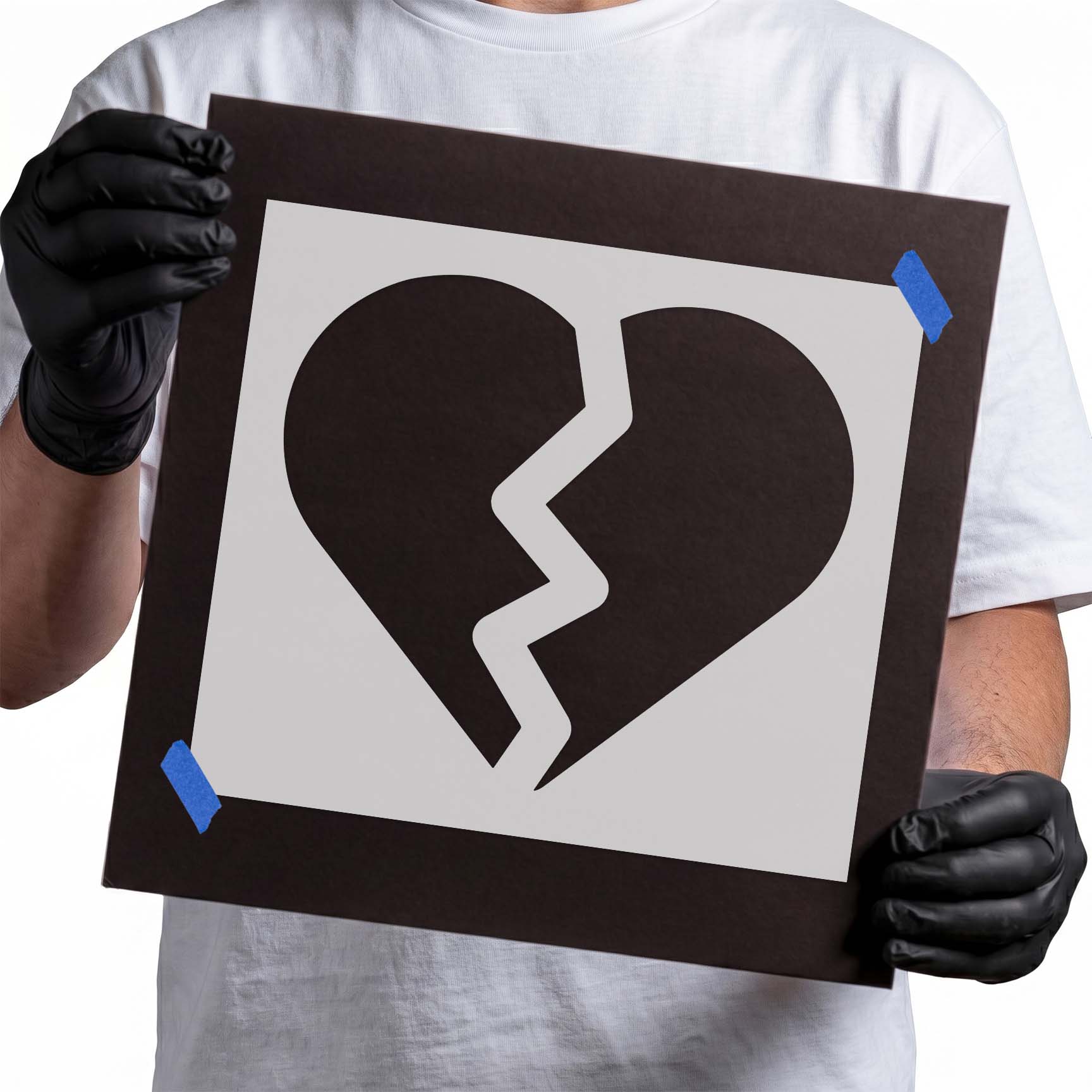 Broken heart stencil with bold silhouette and jagged center crack