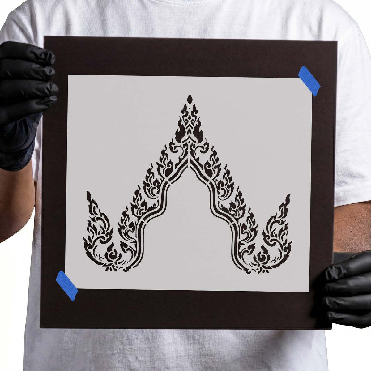 Buddha stencil outline with symmetrical flame-like ornamental pattern