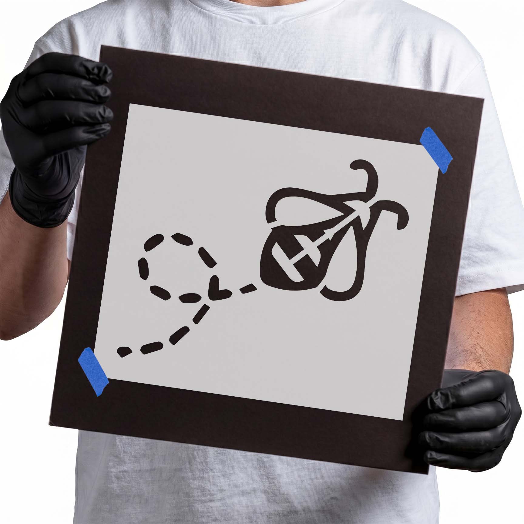 Person holding a laser-cut Busy Bee Stencil
