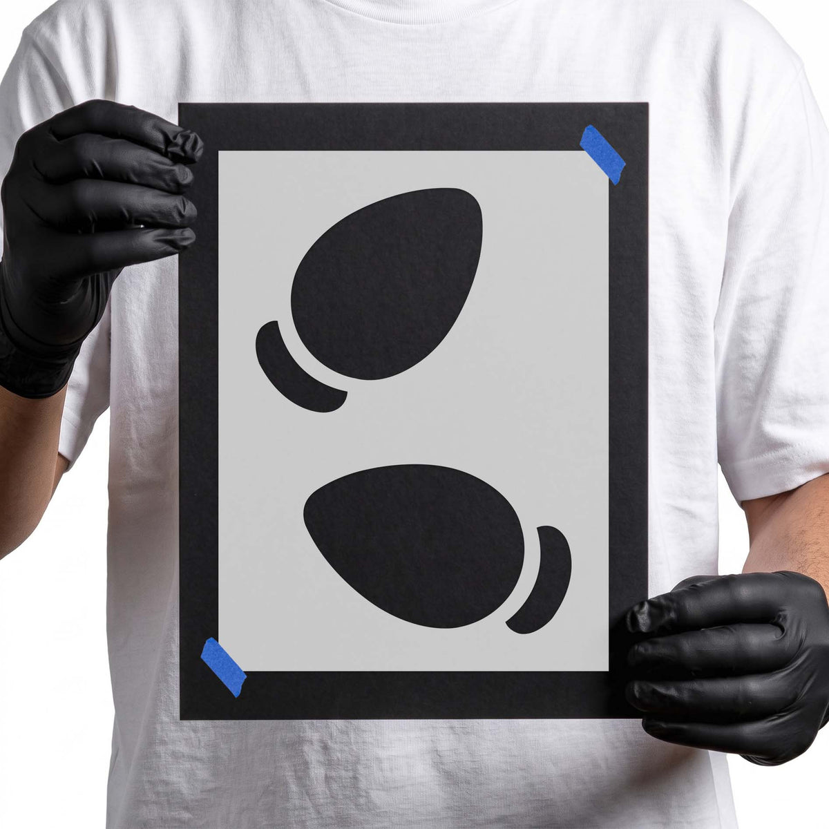 Stencil featuring two oversized Christmas light bulb silhouettes