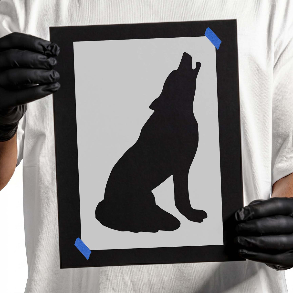 Coyote stencil featuring a seated howling animal silhouette