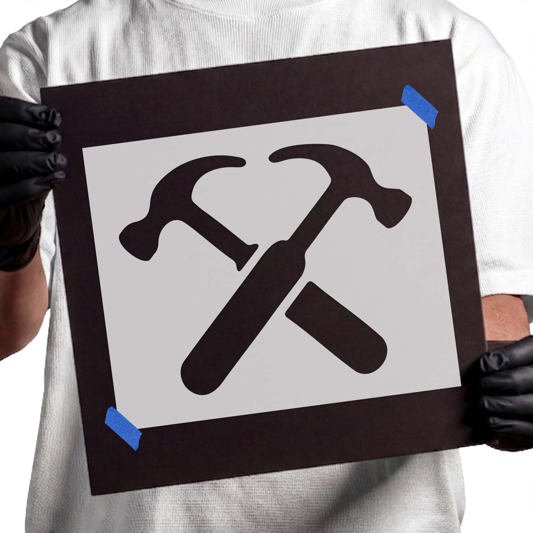 Crossed hammer stencil with bold construction tool silhouettes