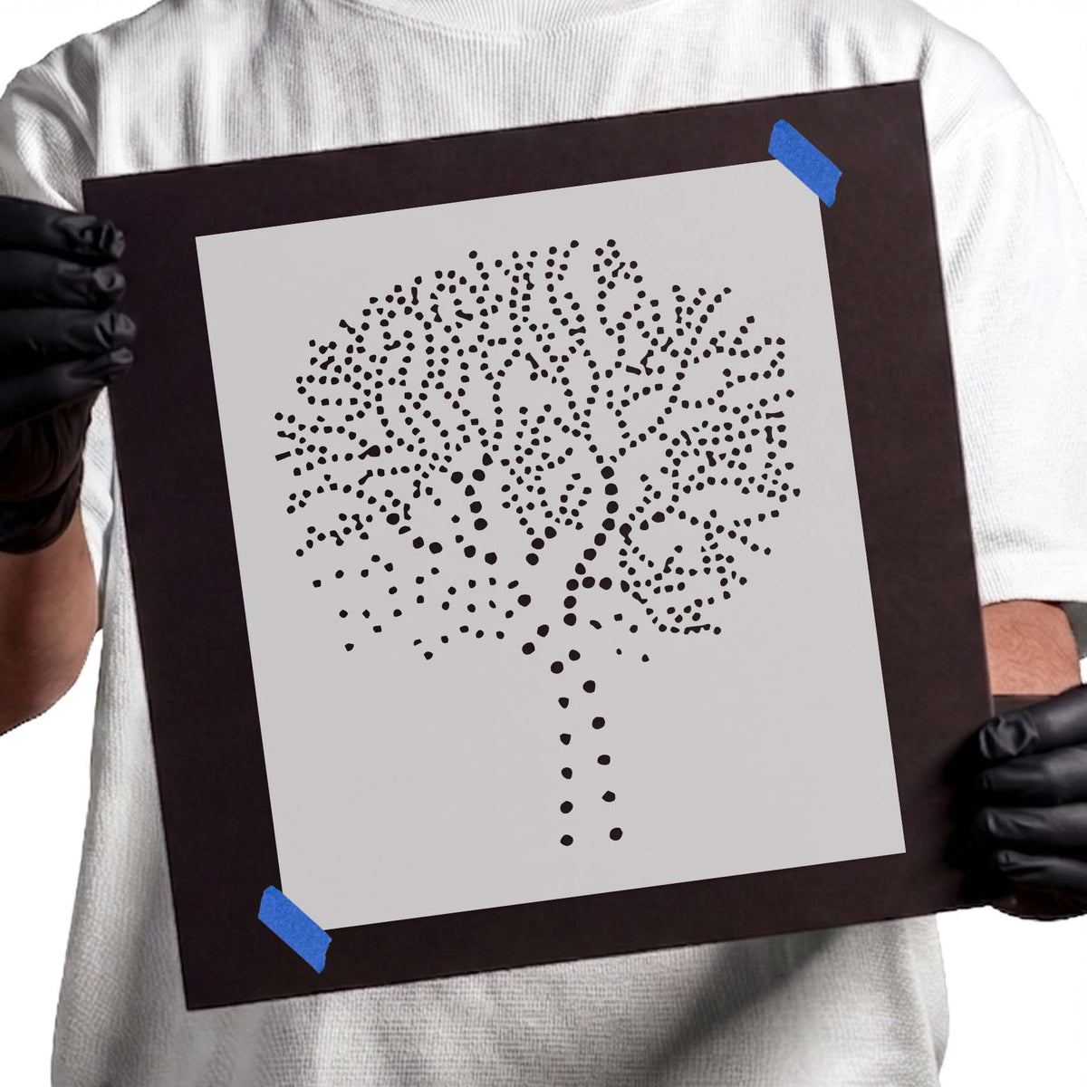 Dotted tree stencil with branching canopy formed from scattered dots